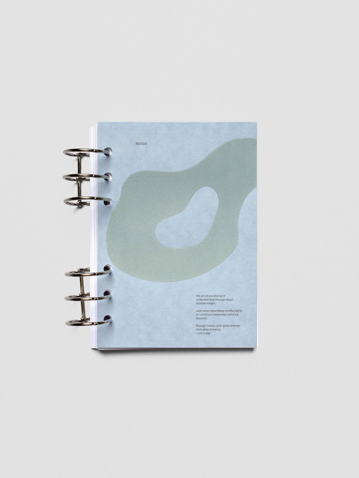 Blue speckle cardstock planner dashboard with organic shape design flocked in blue-green with text design shown in Personal Wide size ring bound.
