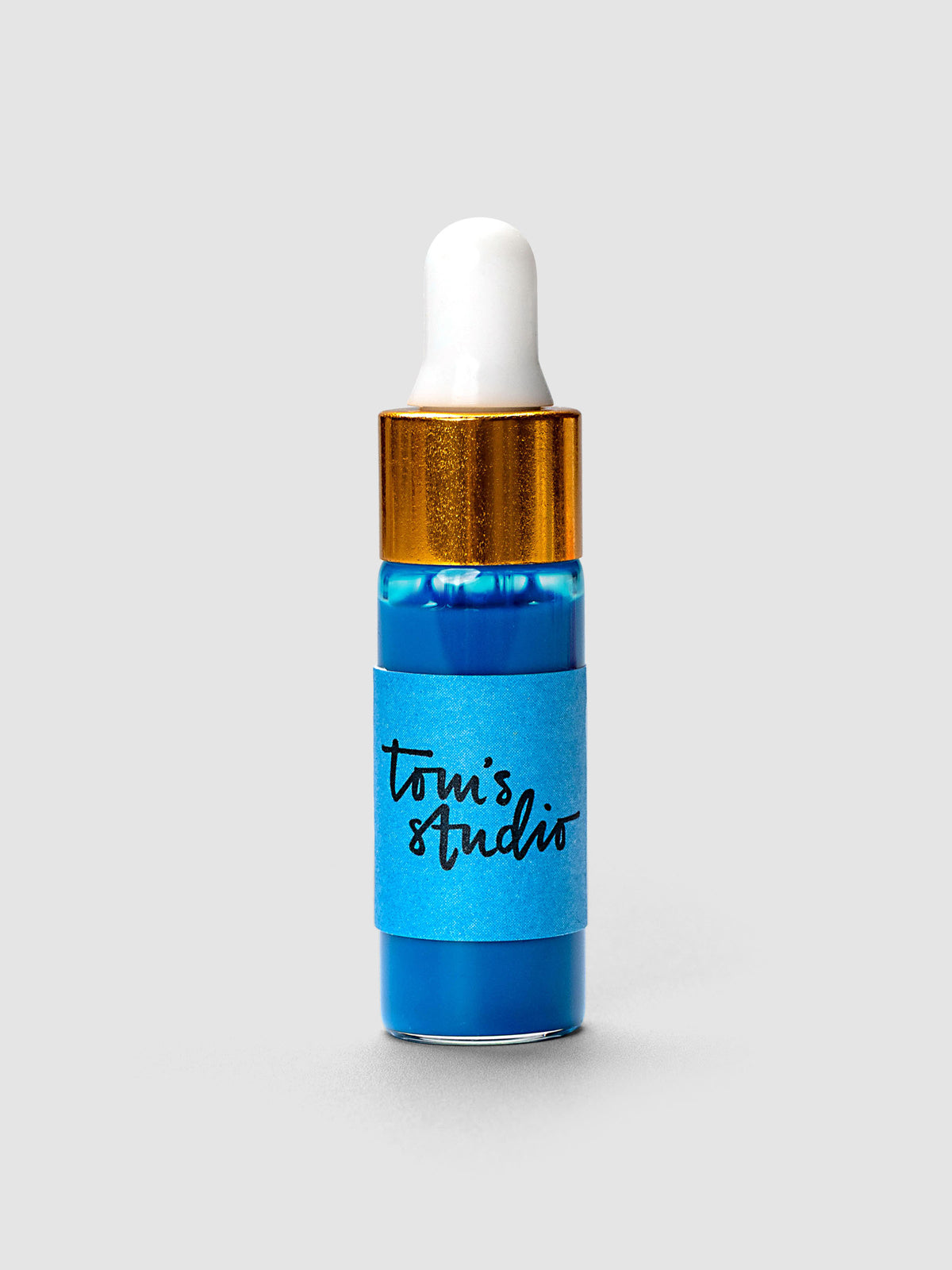 Tom's Studio Mini Highlighter Ink bottle with gold cap and white dropper in blue