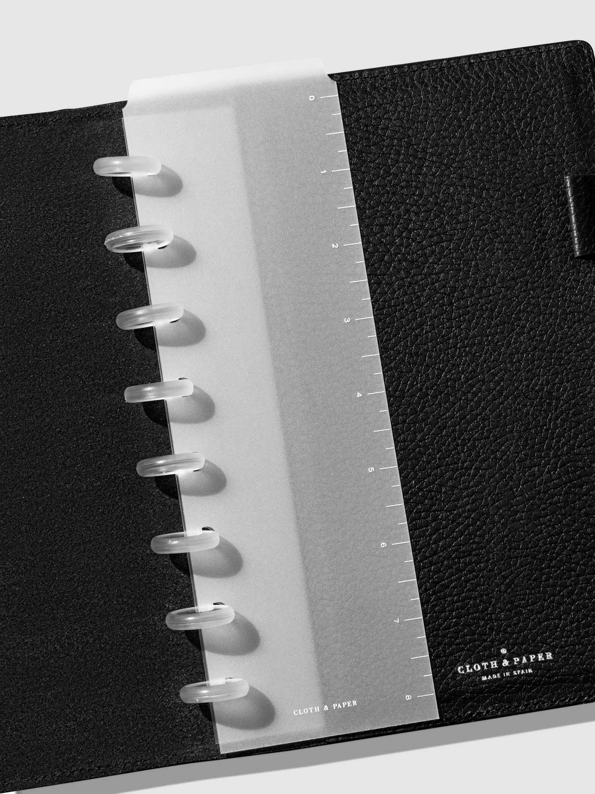 Page marker in use inside a black leather agenda.