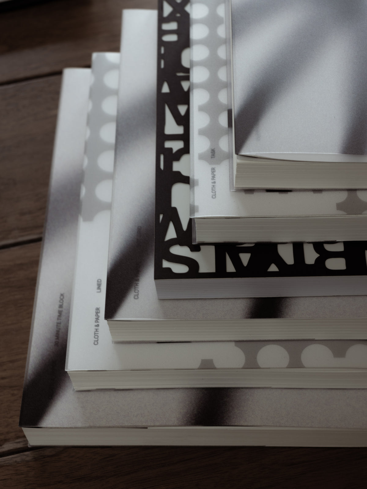The Precision Notebook | A5 closed, showing the cover cut all the way through in the Precision letter pattern over a light layer beneath
