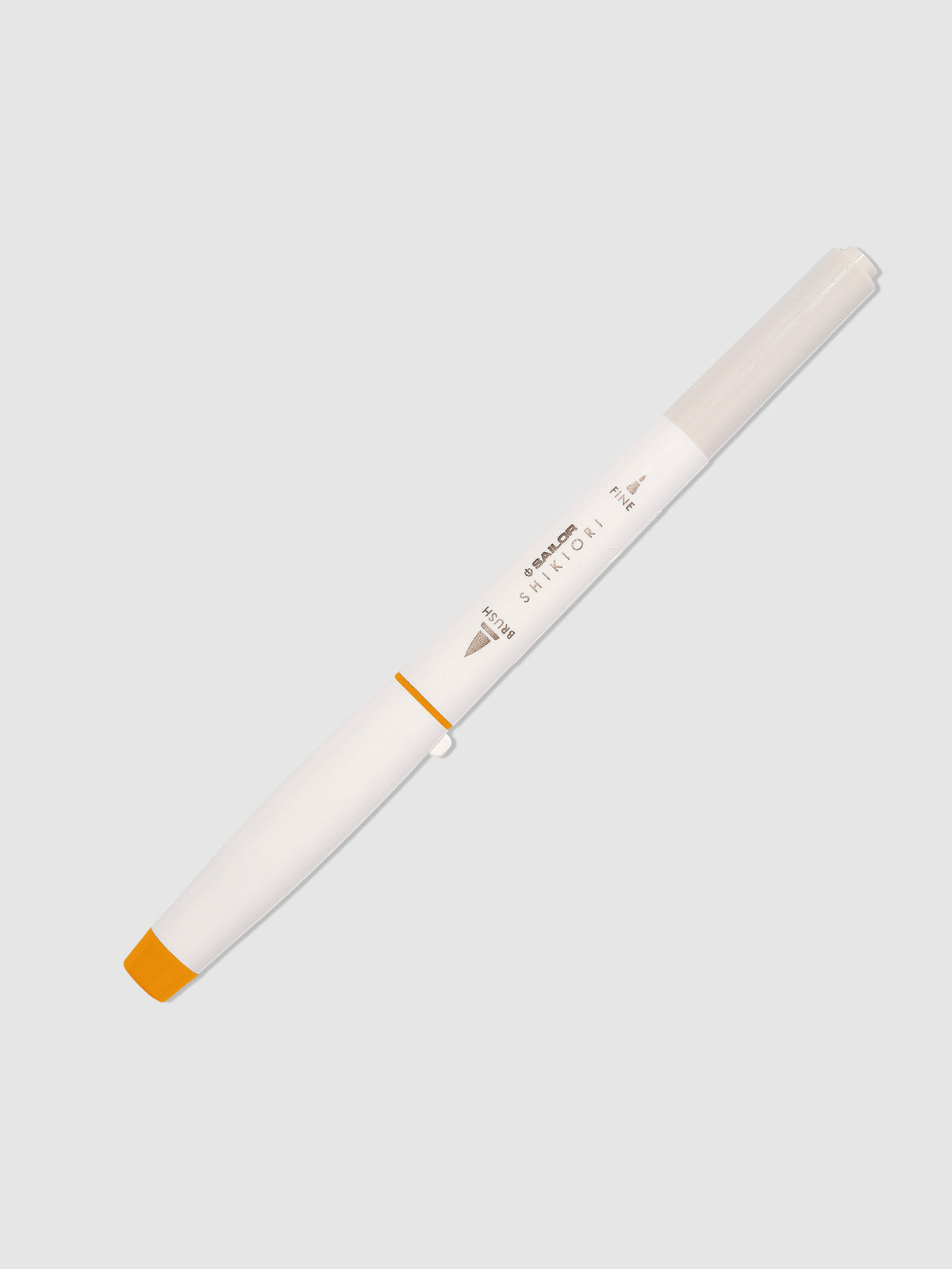 Brush pen displayed on a neutral background. Color pictured is Kinmokusei. 