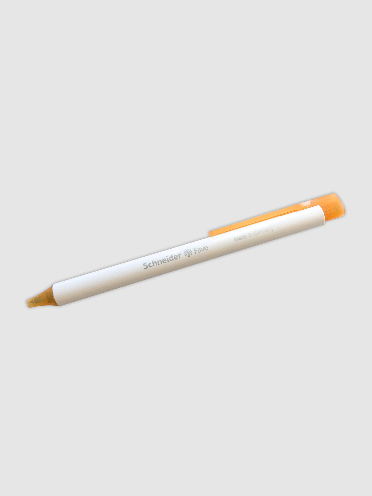 Always a Fave Pen, Gold, Cloth and Paper. Pen turned to the right against a neutral background.