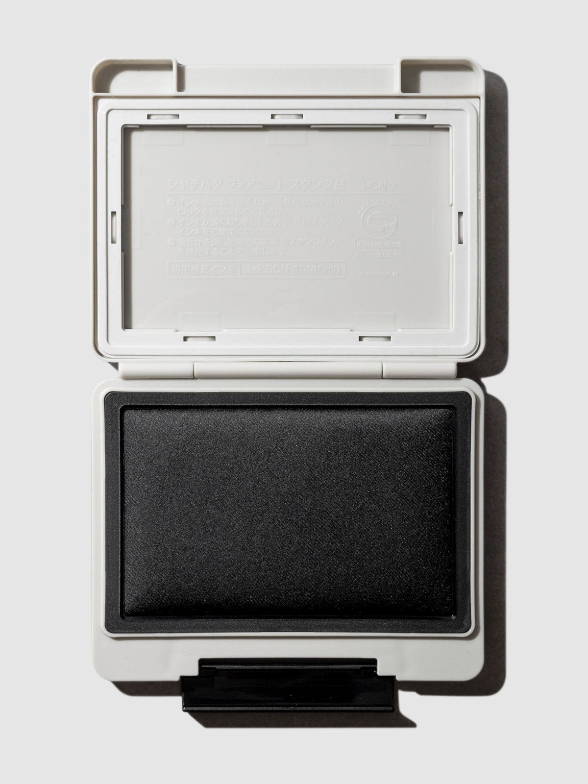 Shachihata Forecoat Stamp, Cloth and Paper. Stamp displayed open on a neutral background.