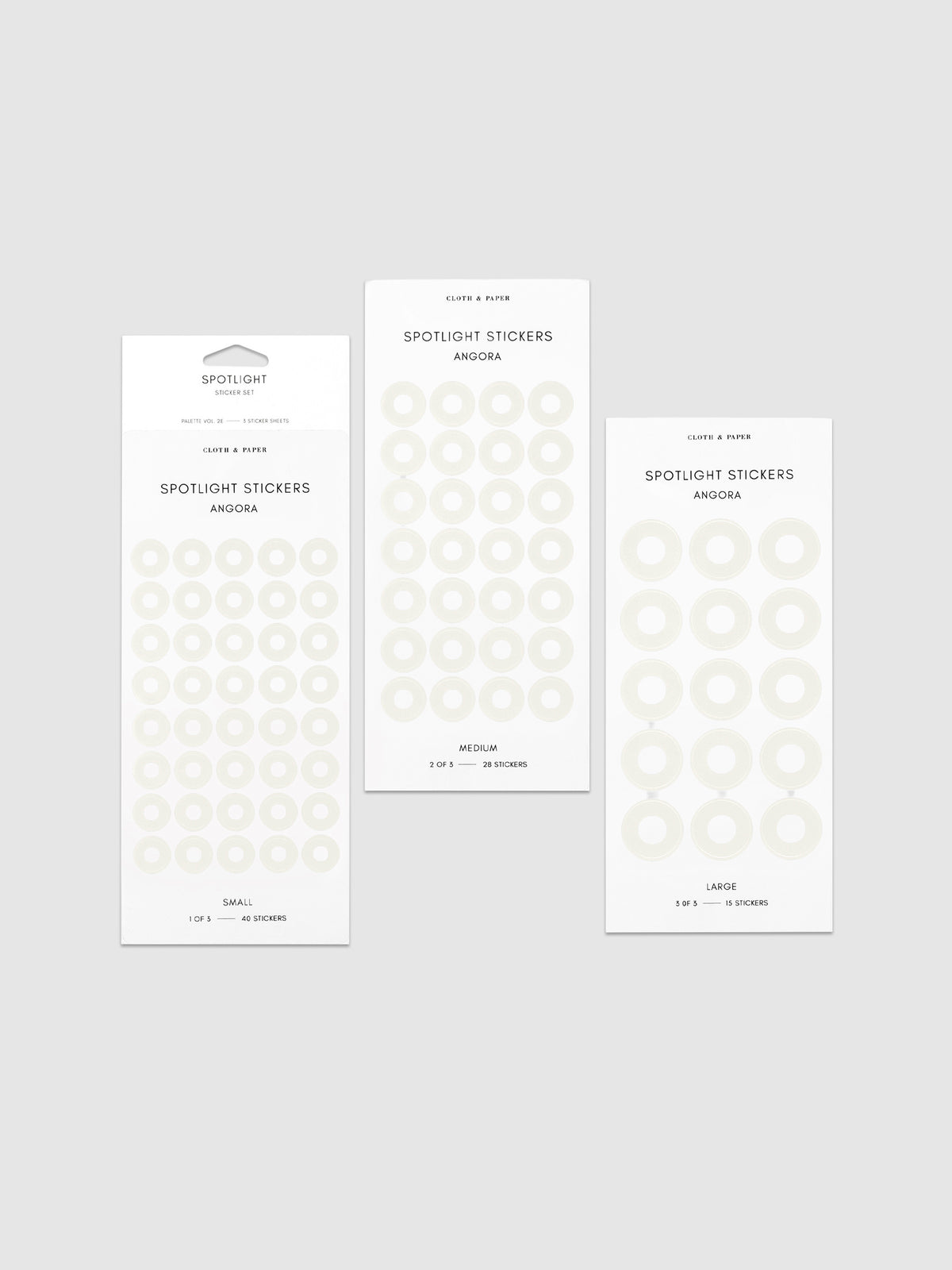 Three sheets of spotlight stickers in small, medium, and large sizing arranged together on a neutral background.