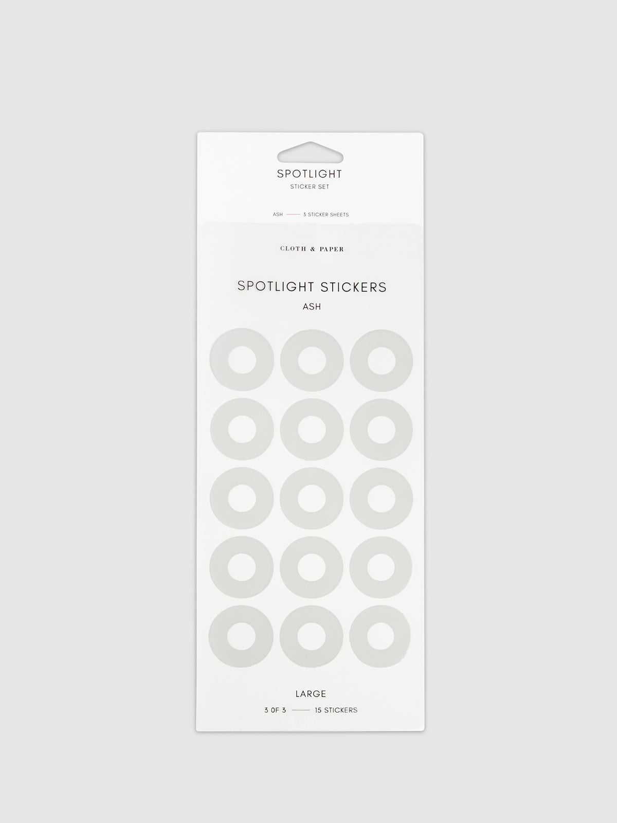 Large sticker in its packaging displayed on a neutral background. Pictured color is Ash.