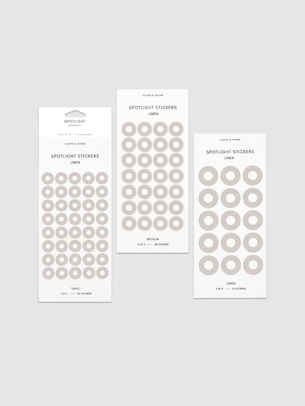 Three sheets of spotlight stickers in small, medium, and large sizing arranged together on a neutral background.
