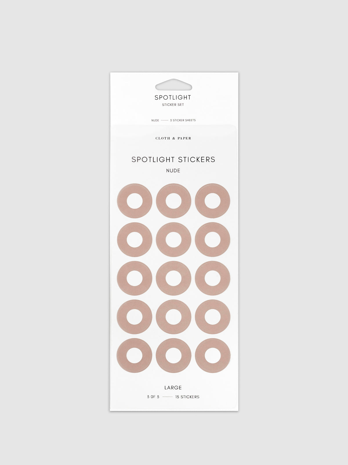 Large sticker in its packaging displayed on a neutral background. Pictured color is nude.