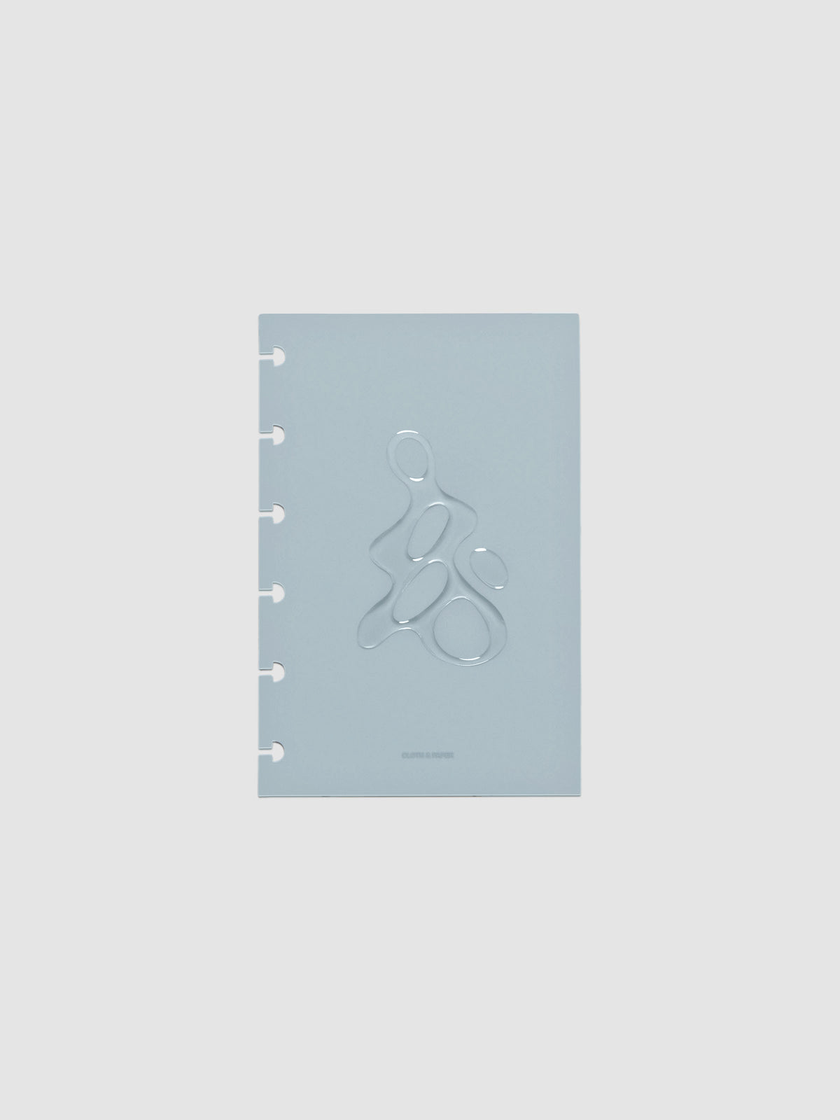 Light blue, semi-transparent, and glossy plastic planner dashboard with organic raised shape design in size CP Petite on a neutral background.