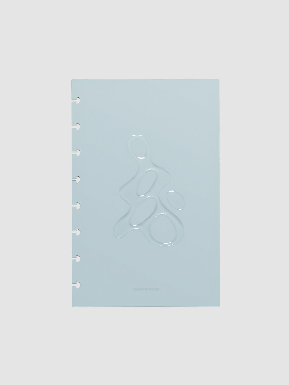 Light blue, semi-transparent, and glossy plastic planner dashboard with organic raised shape design in size Half Letter on a neutral background.