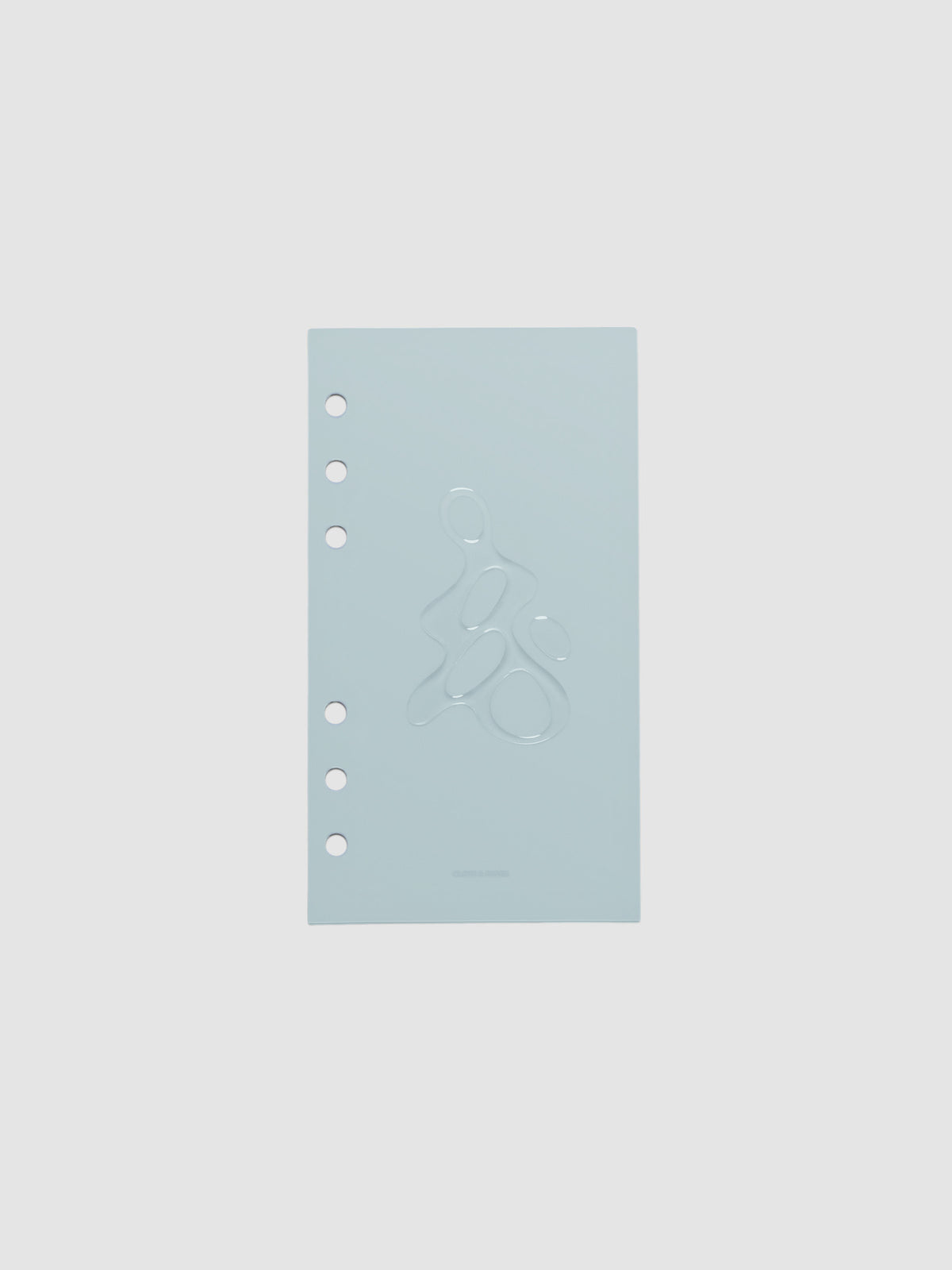 Light blue, semi-transparent, and glossy plastic planner dashboard with organic raised shape design in size Personal on a neutral background.