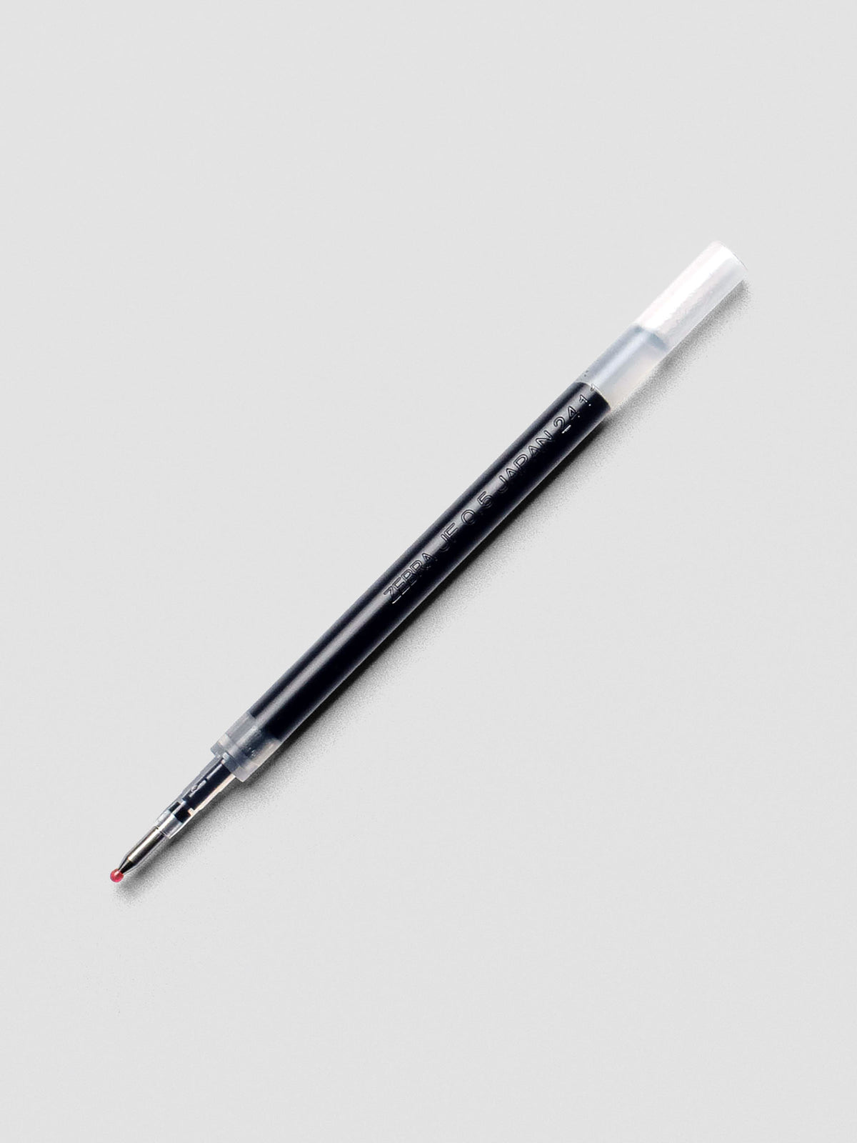 Zebra Sarasa 0.5 mm black gel pen refill on white background.