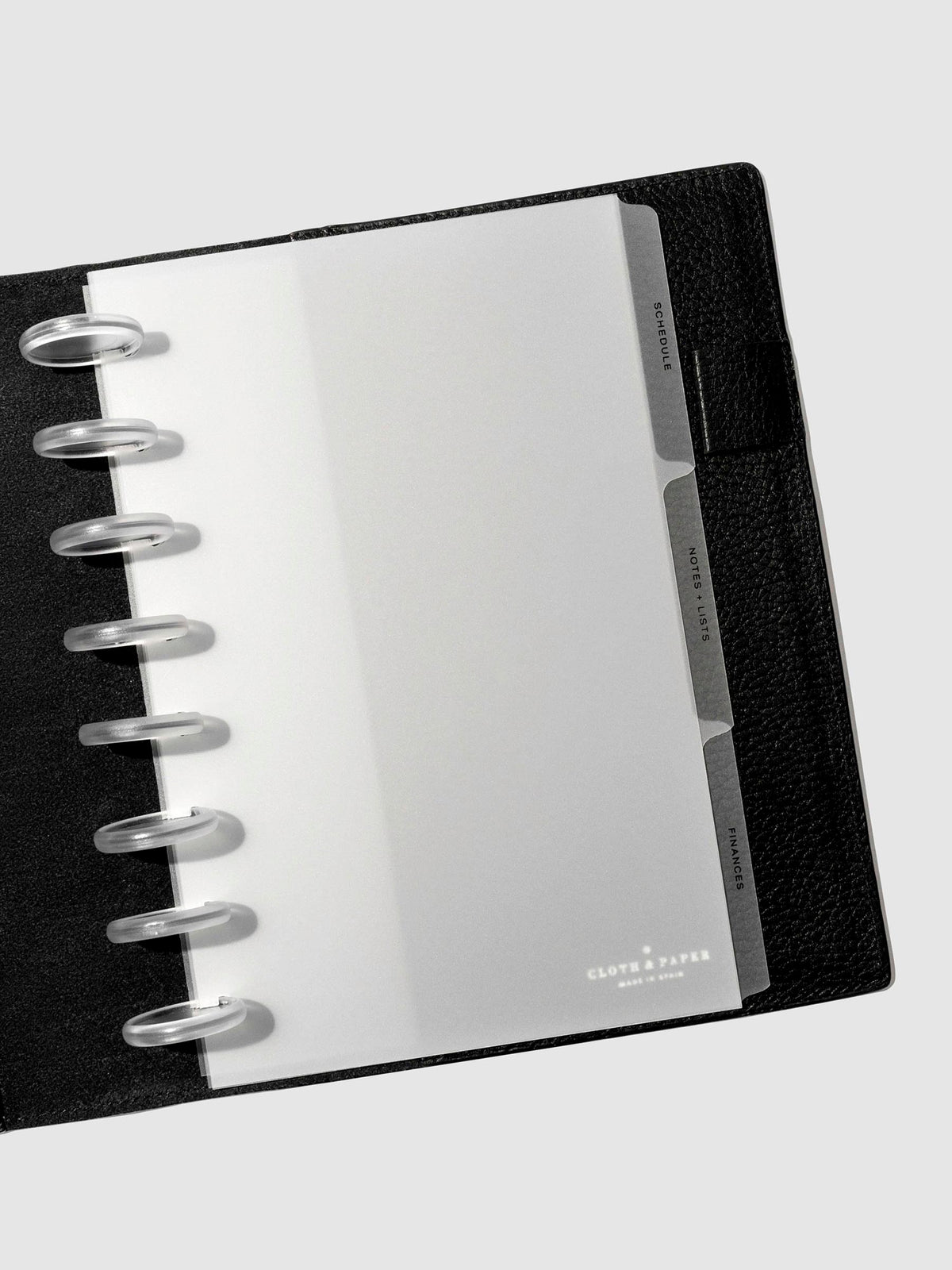 Black foil tabs displayed in use inside a  leather folio.