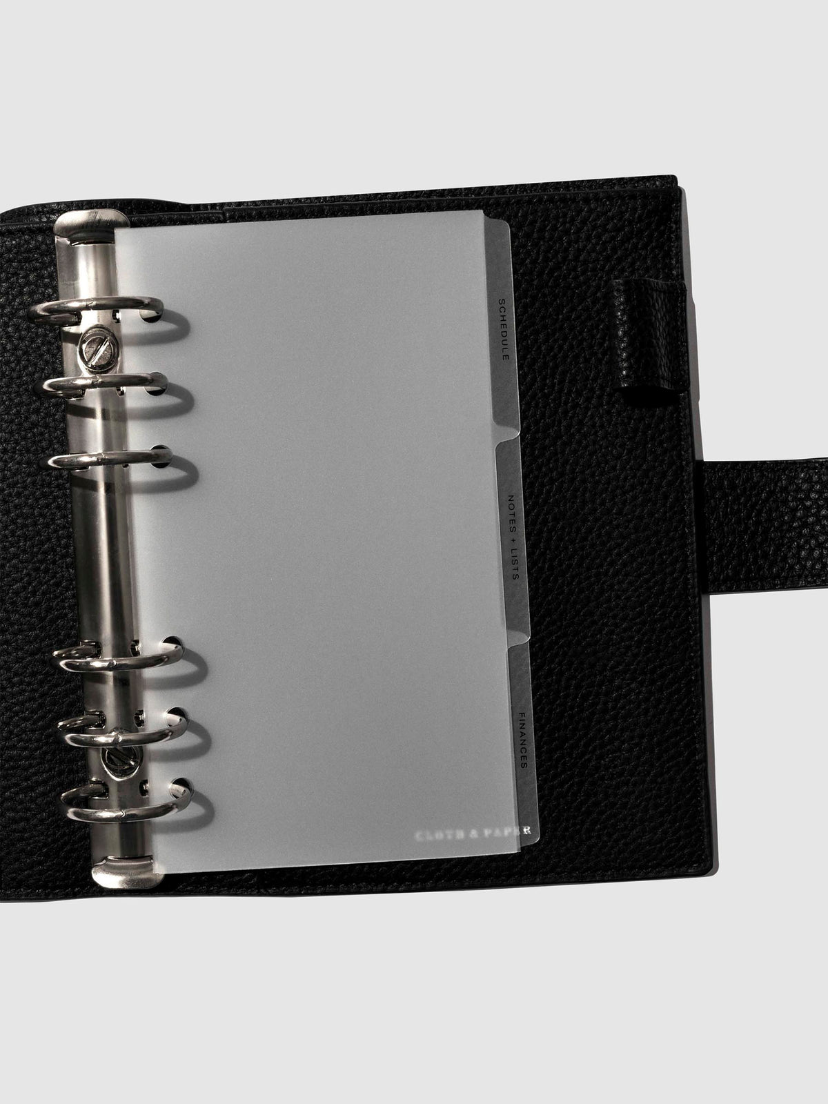 Black foil tabs displayed in use inside a  leather folio.