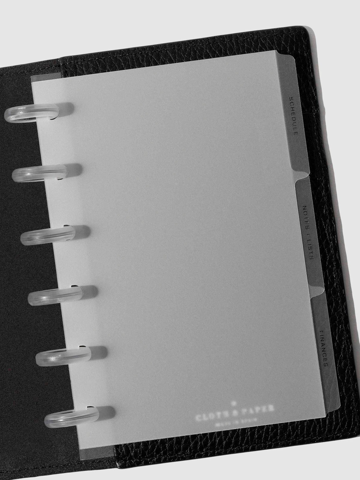 Black foil tabs displayed in use inside a  leather folio.