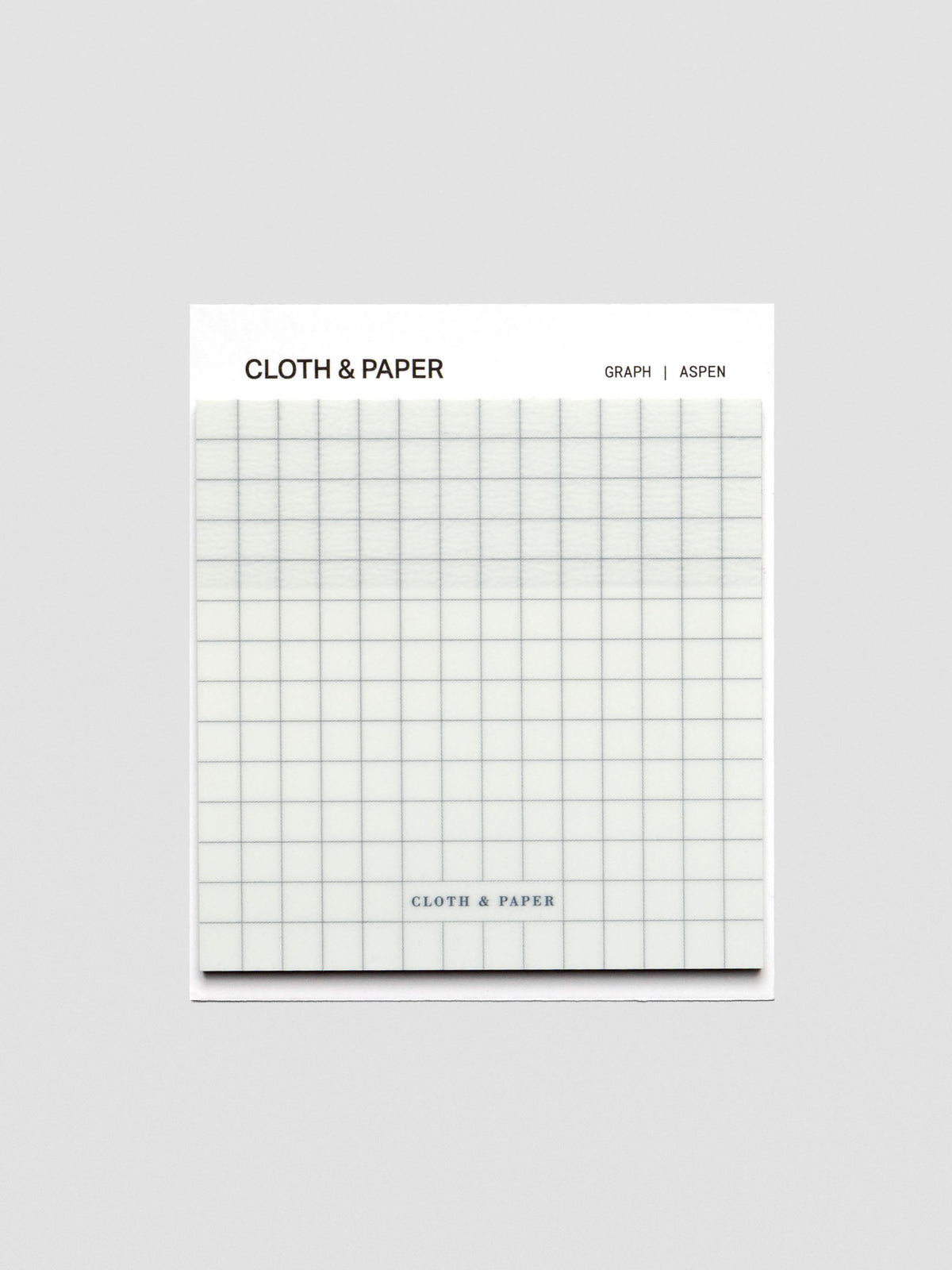 A single square transparent sticky note pad with an all-over graphite grid design, packaged with Cloth & Paper branding at the top.