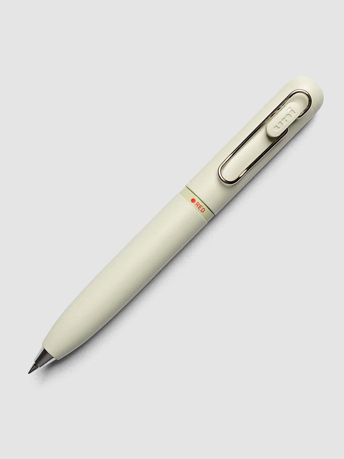 Uni-ball One 3-Color Ballpoint Pen in pale sage green close up of barrel showing RED color indicator