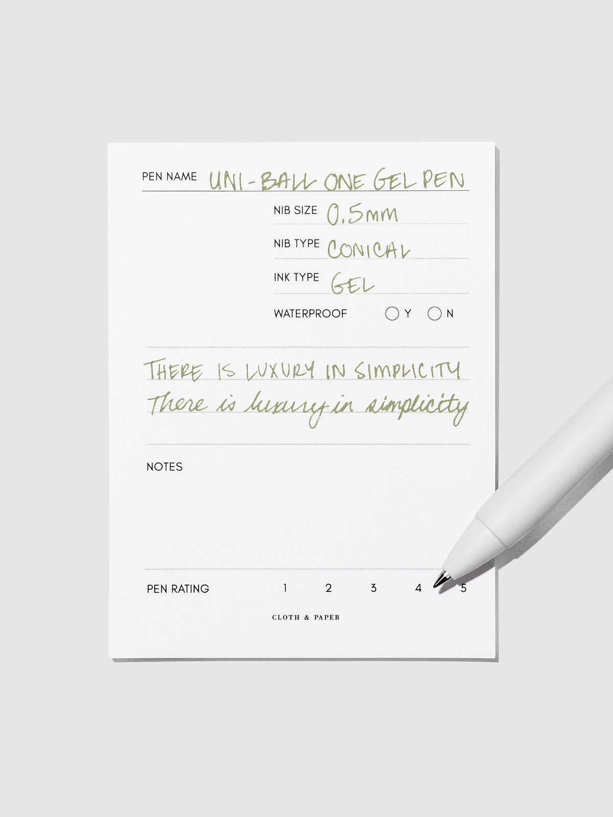 Pen tilted slightly to the right on a neutral background. Color pictured is Avocado Green.