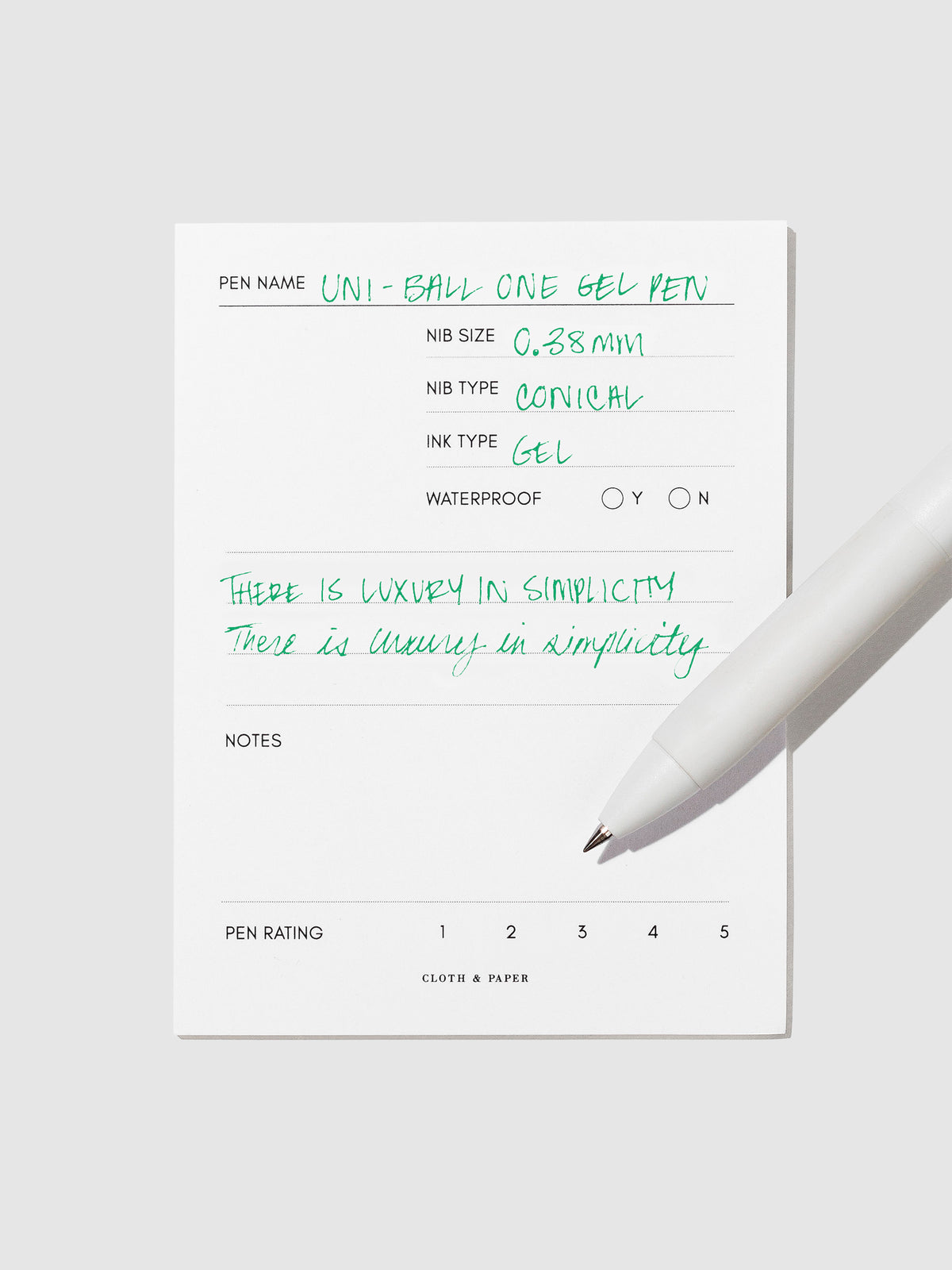 Pen tilted slightly to the right on a neutral background. Color pictured is  Green.