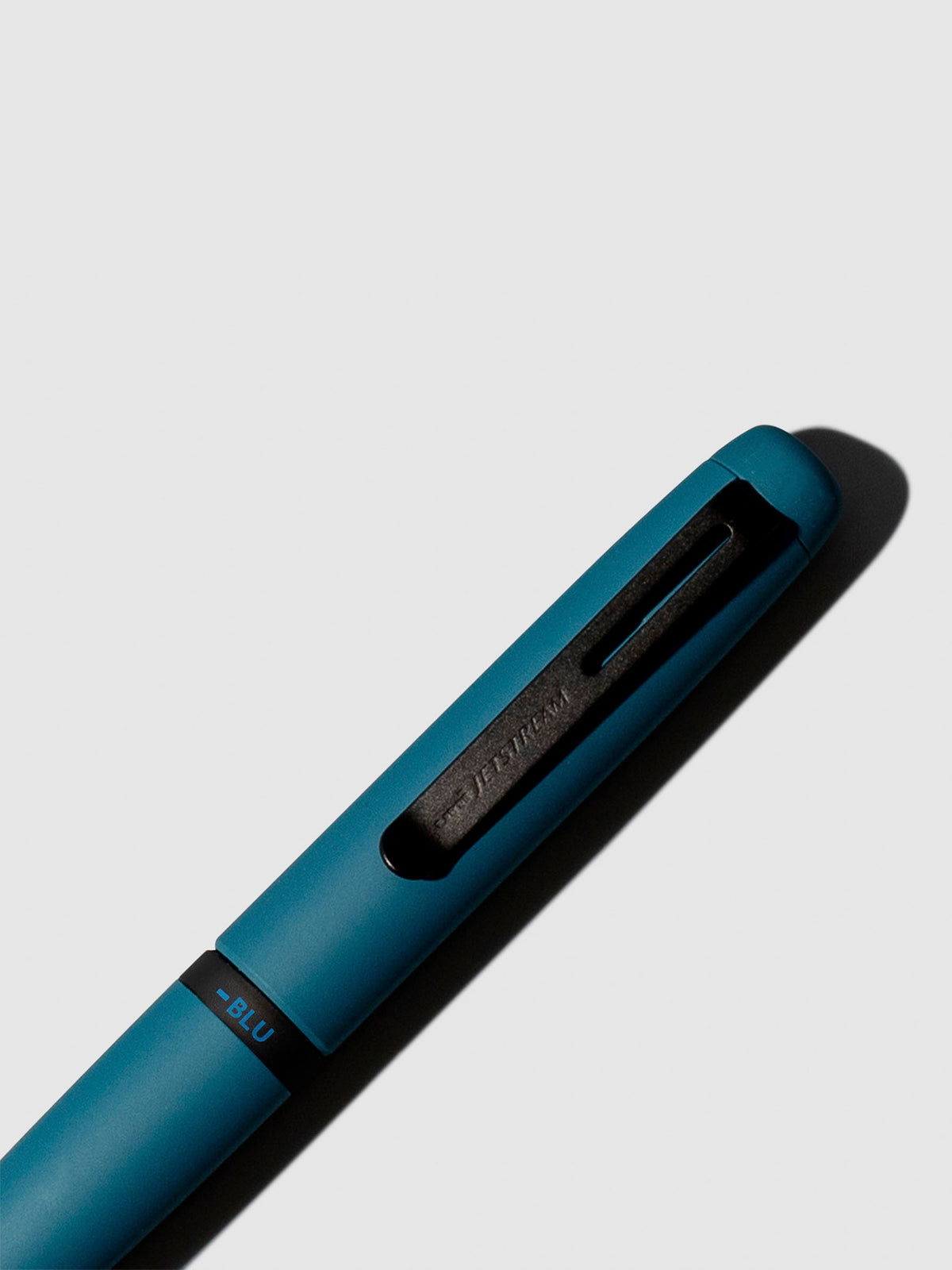 Pen shown close up, with the color selecting ring in focus. Pen ink color selected is blue, pen body is Ivy Green.