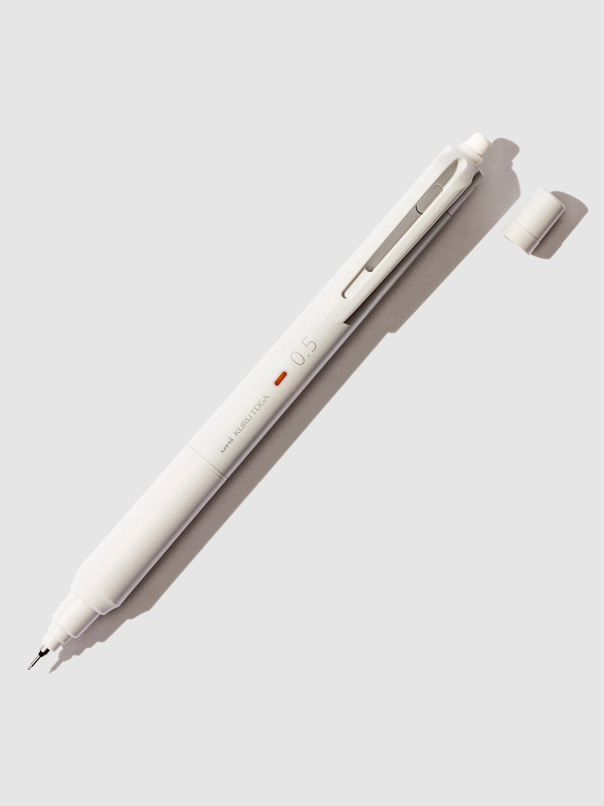 Uni Kuru Toga KS Mechanical Pencil. Grey pencil displayed on a neutral background.