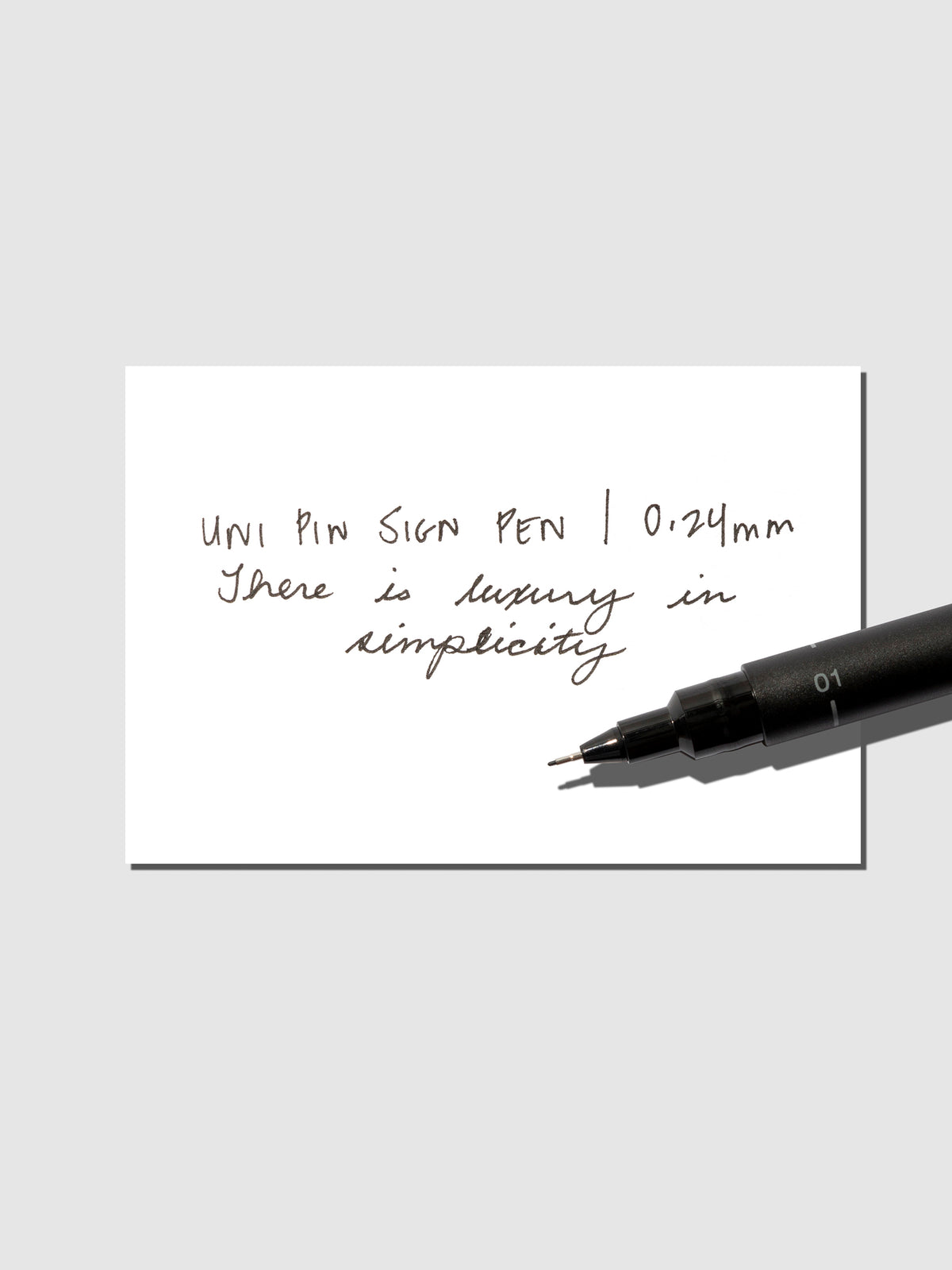 Pen shown resting on an in use tester sheet.