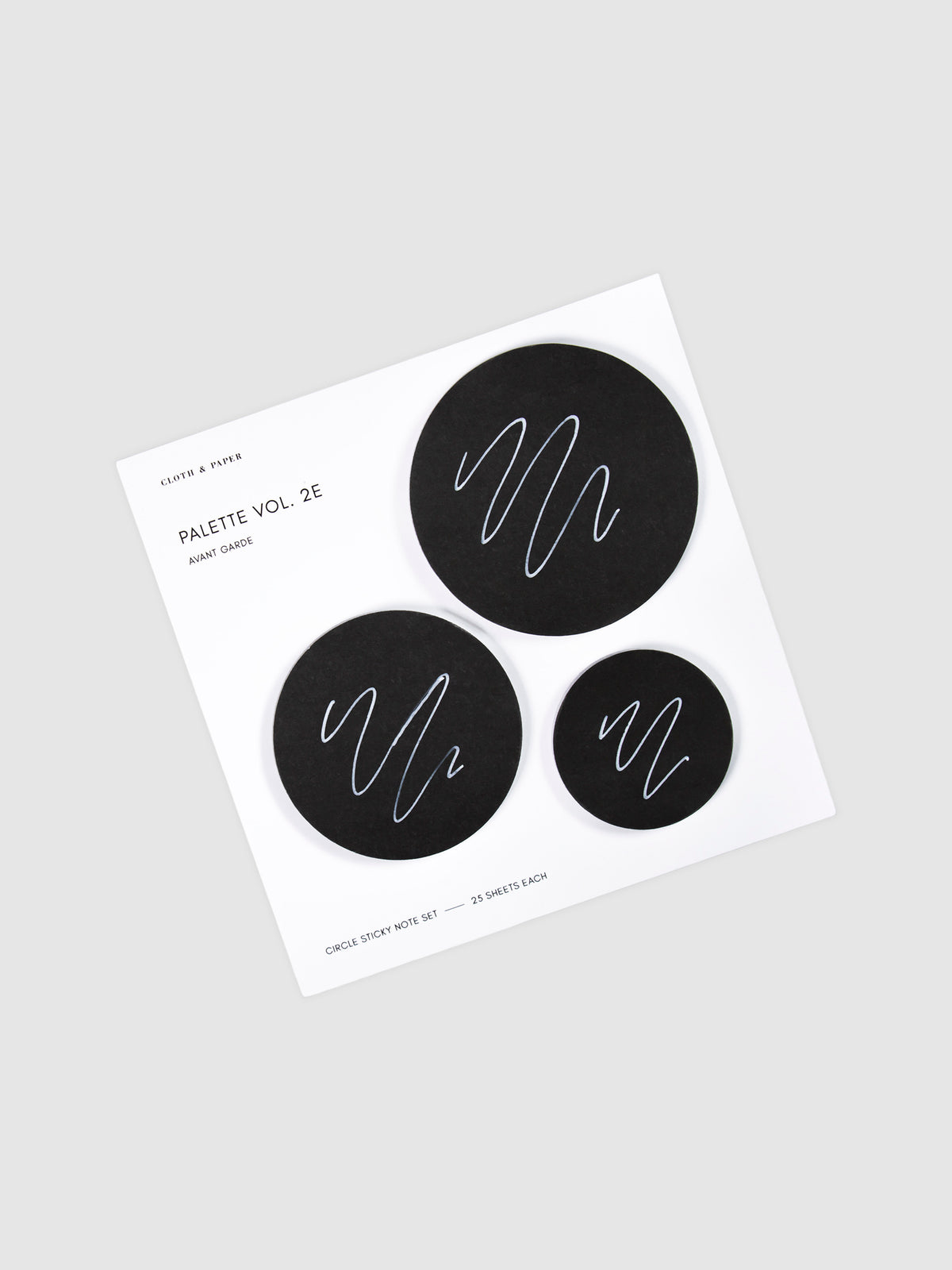 Uni Posca Paint Marker, Ultra Fine Point, White, Cloth and Paper. Marker writing sample displayed on Circle Sticky Note Set in Avant Garde or black paper.