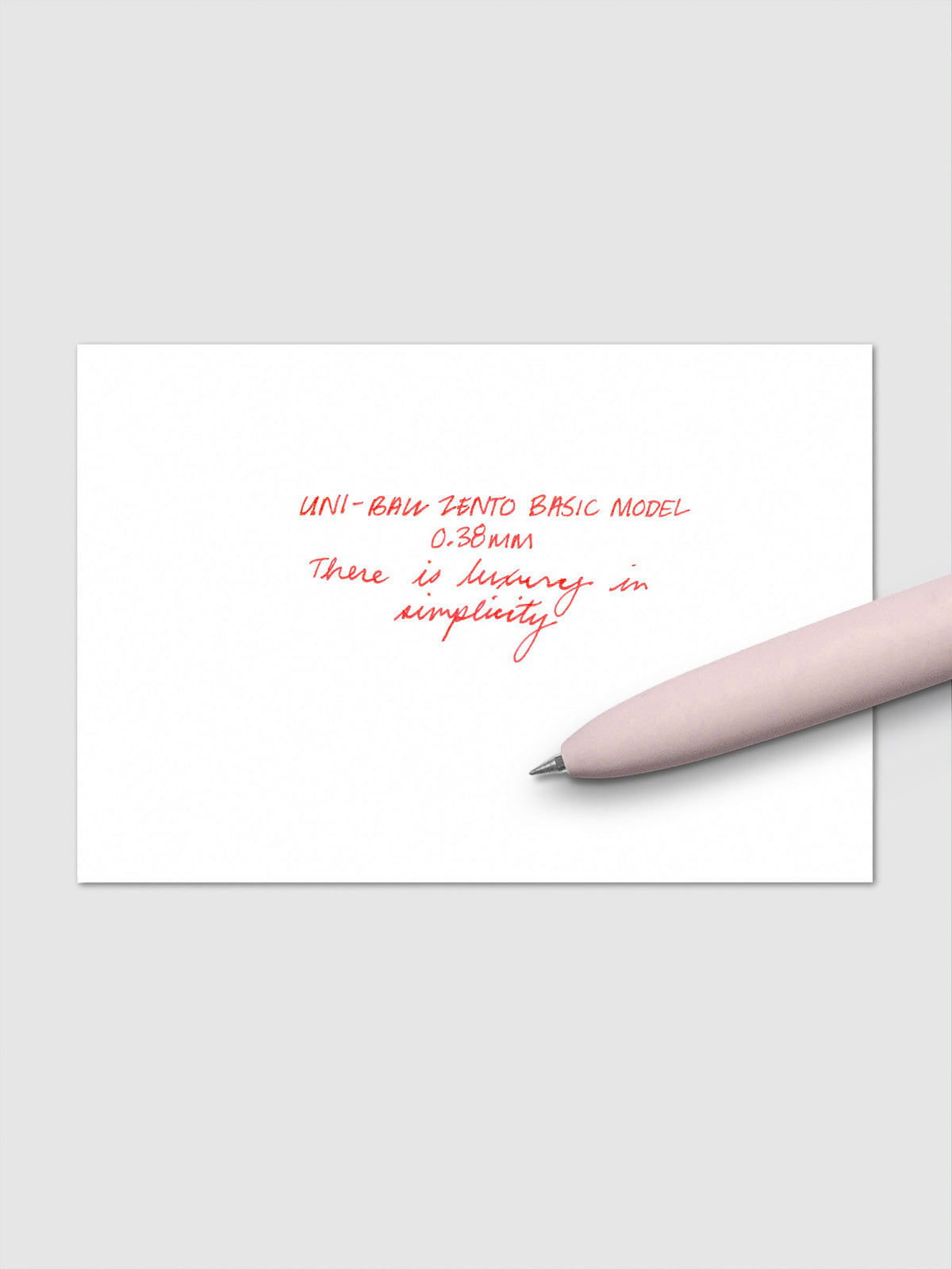 Handwritten writing sample using the Uni-ball Zento Basic Model Pen in Red with nib size 0.38 mm.