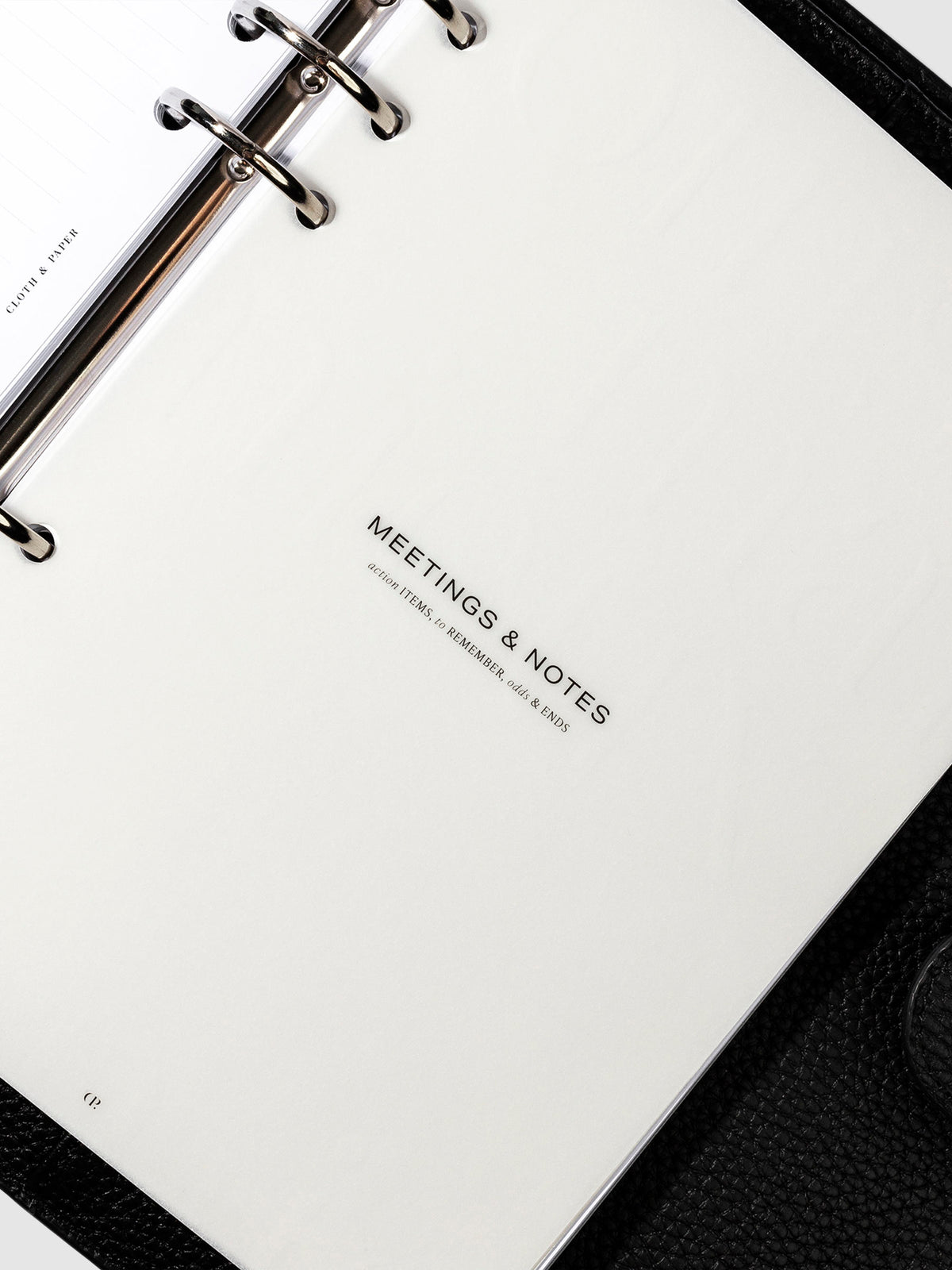 Meetings and Notes  dashboard in use inside a leather planner.
