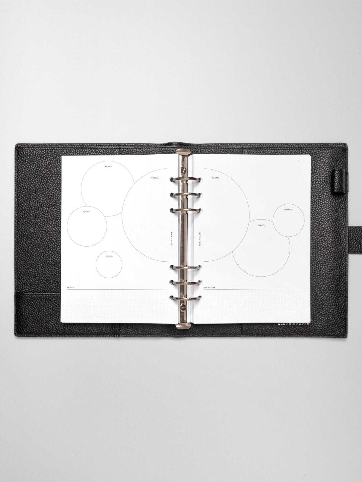 Insert in use inside a black leather planner.