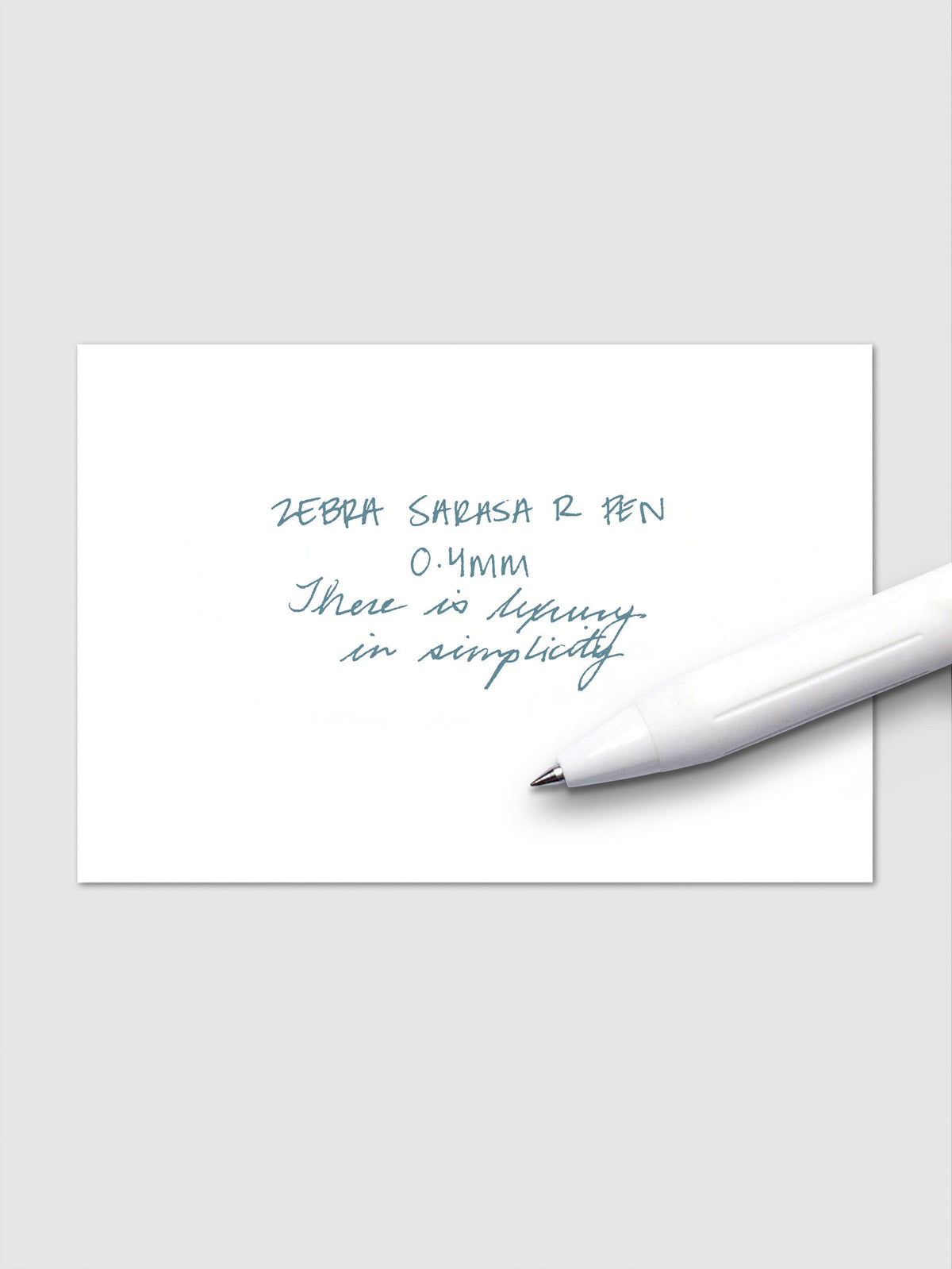 Writing sample using Zebra Sarasa R 0.4mm pen in green-black ink on white paper.