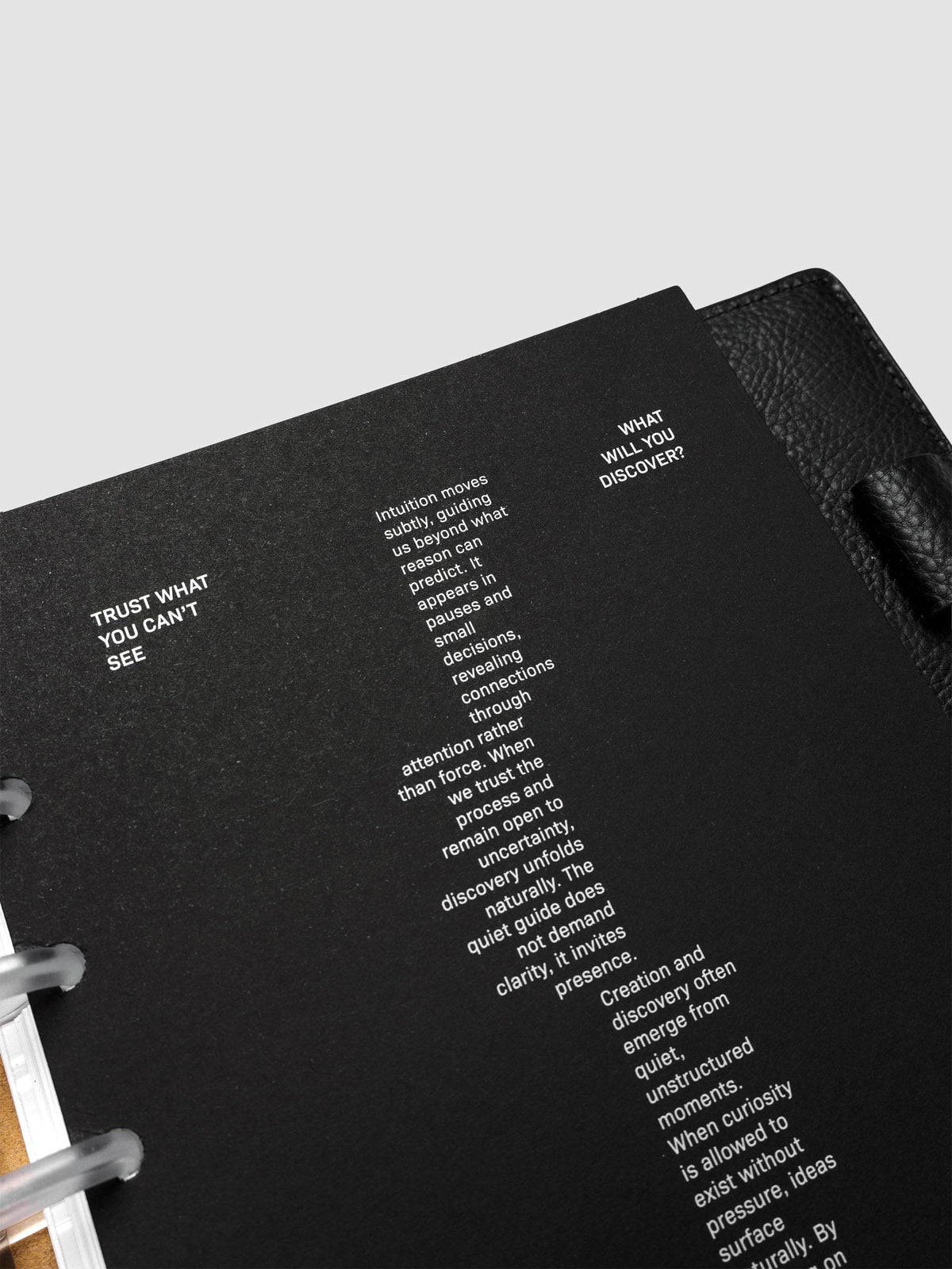 Detail view of the black Intuition Ultra Thin Planner Cover + Dashboard Set.