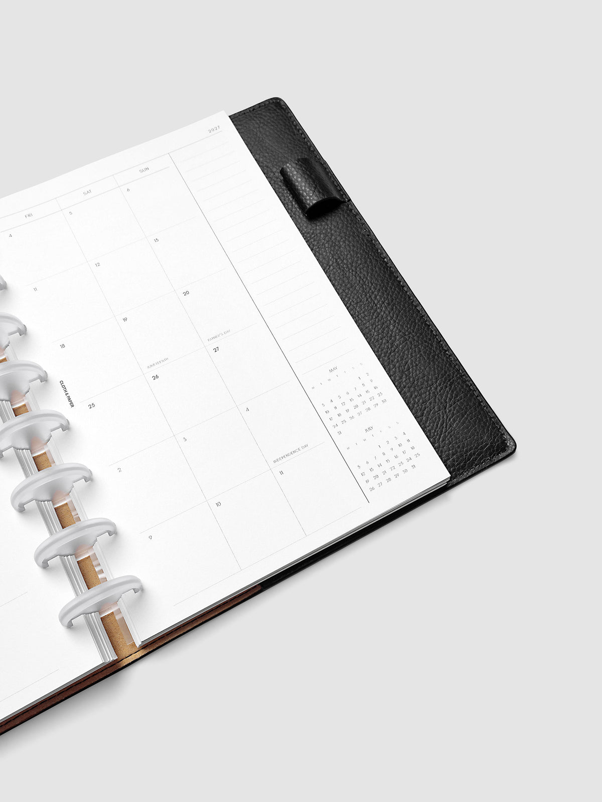 2027 Dated Monthly Planner Inserts, Monday Start, Half Letter 8-Disc Punch, close-up detail of right page showing mini calendars in the bottom right corner and notes column shown inside a planner