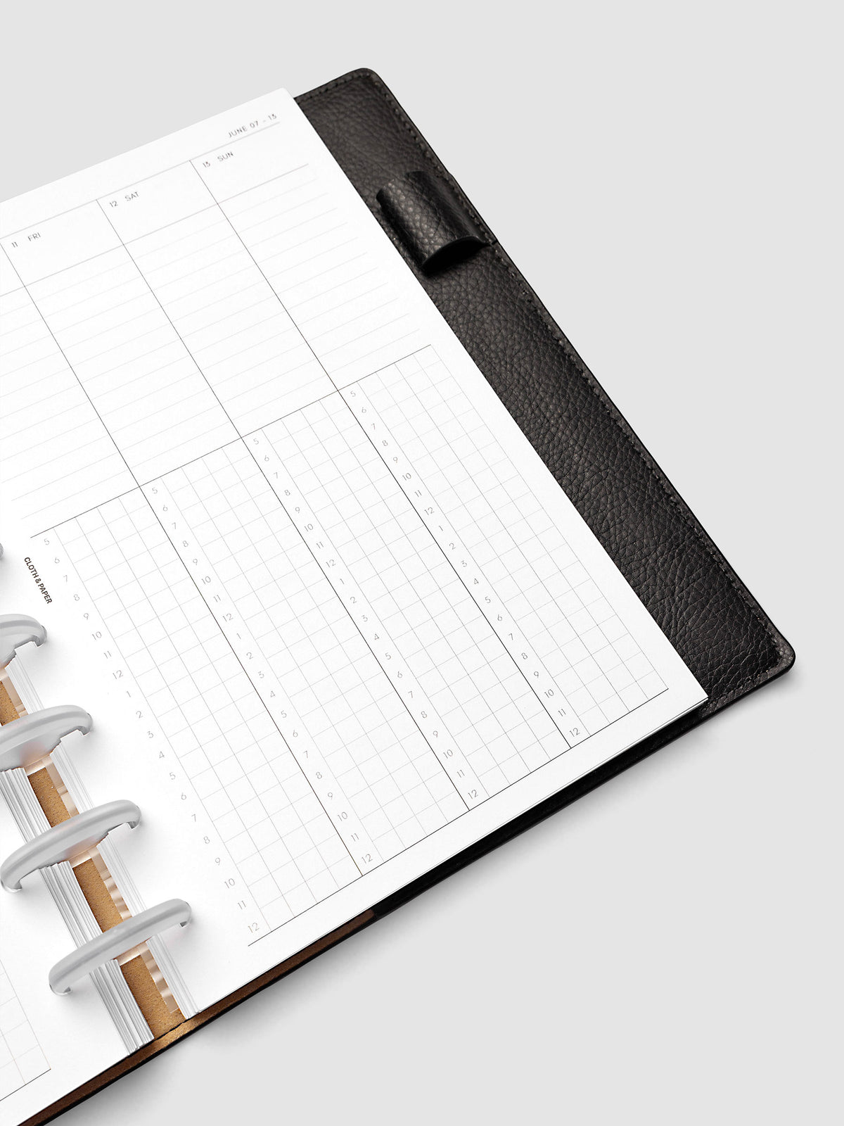 Half Letter 8-Disc Punch right page detail showing time blocking grid in a planner