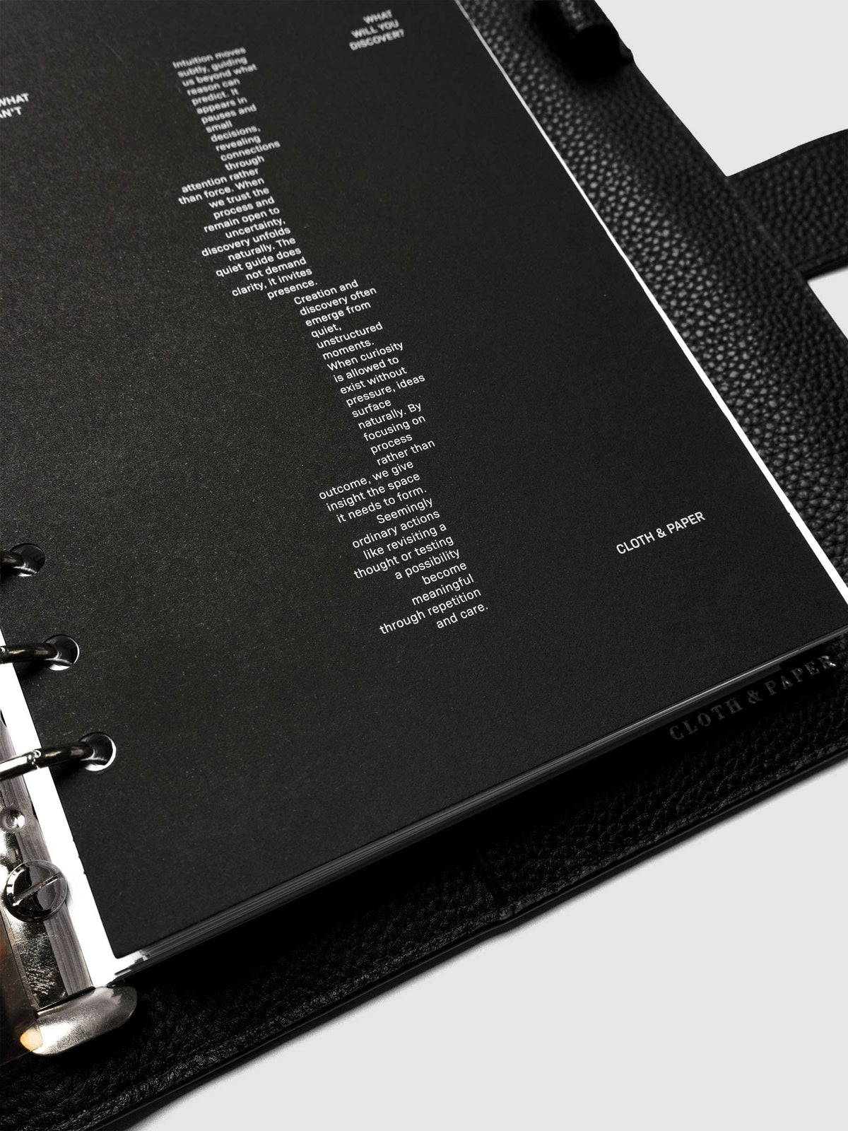 Detail view of the black Intuition Ultra Thin Planner Cover + Dashboard Set.