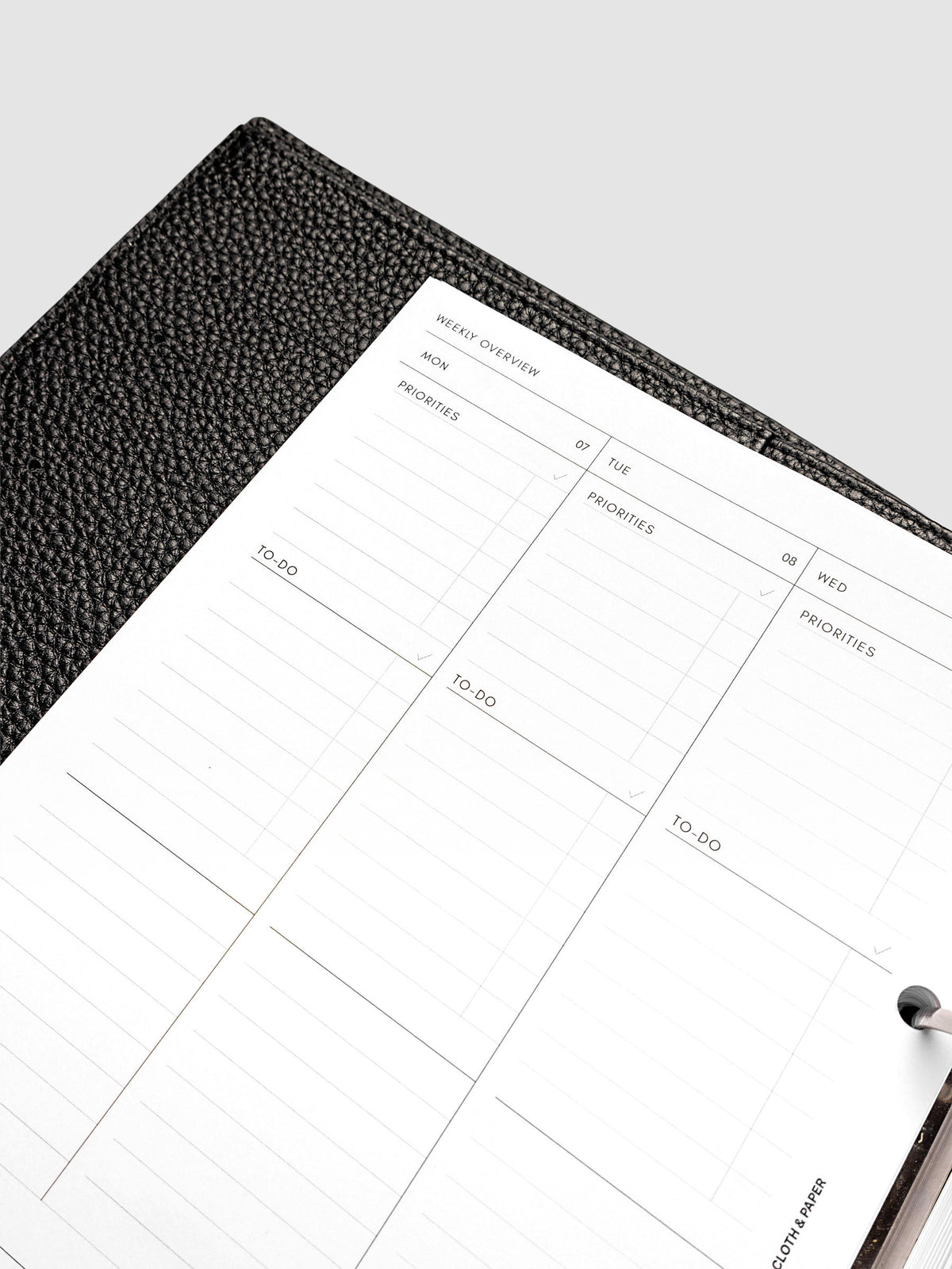 2027 Dated Weekly Task Planner Inserts, Monday Start, A5 6-Ring Punch, close-up of the top of the left page showing labeled priorities and to-do sections at the top of each weekday column
