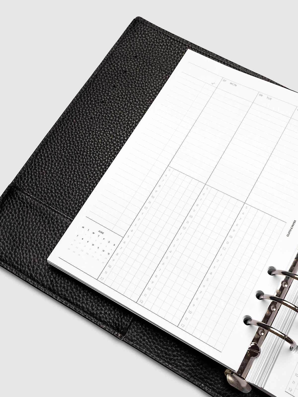 A5 6-Ring Punch left page detail showing task column, mini monthly calendar, and lined section in a planner